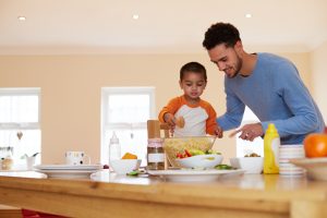 father_and_son_working_together_in_kitchen