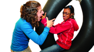 Girl on swing with therapist