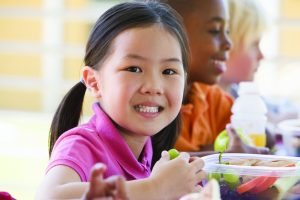 little_girl_eating_grapes_at_school